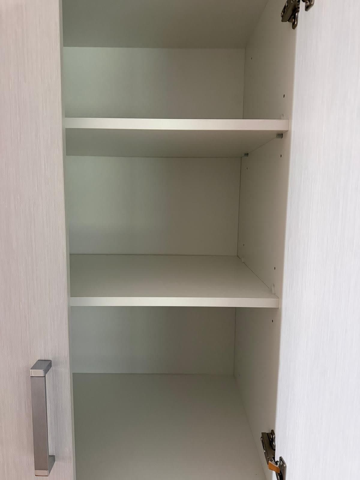 Clean kitchen pantry shelves and cabinet interior - end of lease clean Adelaide